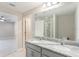 Double sink bathroom vanity with granite countertop and mirrored medicine cabinet at 2025 Havasu Falls Ave, Deland, FL 32724