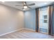 Bedroom with two-tone walls, ceiling fan, and window with curtains at 2025 Havasu Falls Ave, Deland, FL 32724