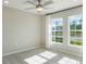 Bright bedroom with carpeted floor, ceiling fan, and large windows at 2025 Havasu Falls Ave, Deland, FL 32724