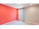 Bedroom with coral and beige walls, window with curtains, and carpet at 2025 Havasu Falls Ave, Deland, FL 32724