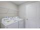 Laundry room with washer, dryer, and overhead shelving at 2025 Havasu Falls Ave, Deland, FL 32724