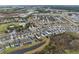 Aerial view of community with houses and lake at 206 Aberdeen Street St, Davenport, FL 33896