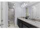 Double vanity bathroom with granite counters at 206 Aberdeen Street St, Davenport, FL 33896