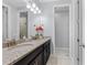 Bathroom with granite double vanity and separate toilet area at 206 Aberdeen Street St, Davenport, FL 33896