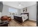 King bedroom with leather chair and large window at 206 Aberdeen Street St, Davenport, FL 33896