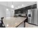 Modern kitchen with stainless steel appliances and an island at 206 Aberdeen Street St, Davenport, FL 33896