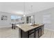 Modern kitchen with granite countertops, stainless steel appliances, and an island at 206 Aberdeen Street St, Davenport, FL 33896