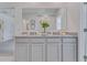 Bathroom with double vanity and granite countertop at 2212 Lake Preserve Cir, New Smyrna Beach, FL 32168