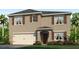 Two-story house with neutral siding, brown accents, and a two-car garage at 2212 Lake Preserve Cir, New Smyrna Beach, FL 32168