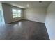 Spacious living room featuring large windows and tile flooring at 2214 Lake Preserve Cir, New Smyrna Beach, FL 32168