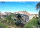 Backyard with a screened patio and lush landscaping at 2311 Caledonian St, Clermont, FL 34711