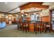 Community clubhouse bar with wood finishes and comfortable seating at 2311 Caledonian St, Clermont, FL 34711