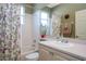 Clean bathroom with floral shower curtain and bathtub at 2311 Caledonian St, Clermont, FL 34711