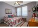 Spacious bedroom with large windows and ceiling fan at 2311 Caledonian St, Clermont, FL 34711