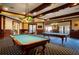 Game room featuring two billiard tables and comfortable seating at 2311 Caledonian St, Clermont, FL 34711