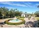 Gated community entrance with fountain and landscaping at 2311 Caledonian St, Clermont, FL 34711