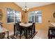 Cozy dining area with a square table and four chairs, perfect for intimate meals at 2311 Caledonian St, Clermont, FL 34711