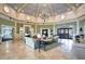 Elegant community clubhouse lobby with comfortable seating and a grand chandelier at 2311 Caledonian St, Clermont, FL 34711