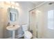 Clean bathroom with a pedestal sink and shower/tub combo at 2566 Ballard Ave, Orlando, FL 32833