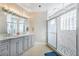 Elegant bathroom featuring a double vanity and large shower at 2566 Ballard Ave, Orlando, FL 32833