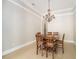 Dining room with a wooden table and chandelier at 2566 Ballard Ave, Orlando, FL 32833