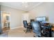 Home office with two workstations and built-in shelving at 2566 Ballard Ave, Orlando, FL 32833