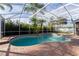 Refreshing pool with screened enclosure and spacious brick patio at 2566 Ballard Ave, Orlando, FL 32833