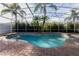 Inviting kidney-shaped pool with a screened enclosure at 2566 Ballard Ave, Orlando, FL 32833