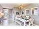 Bright dining room with white table and seating for four at 2965 Moulin Rd, Davenport, FL 33837