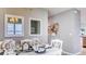 Dining area with white table, coastal decor, and adjacent kitchen at 2965 Moulin Rd, Davenport, FL 33837