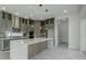 Modern kitchen with gray cabinets, quartz countertops, and large island at 3028 Kensington Ave, Davenport, FL 33837