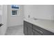 Laundry room with gray cabinets and quartz countertop at 3028 Kensington Ave, Davenport, FL 33837