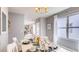 Dining area with white table, neutral decor, and natural light at 3106 Partington Blvd, Davenport, FL 33837