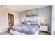 Main bedroom with a plush bed, neutral tones, and ensuite bathroom at 3106 Partington Blvd, Davenport, FL 33837