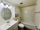 Bathroom with a tub, toilet, and vanity with a mirror at 318 Scottsdale Sq # 318, Winter Park, FL 32792