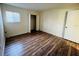 Bedroom with wood-look flooring and a closet at 318 Scottsdale Sq # 318, Winter Park, FL 32792