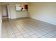 Bright living room with tile floors and kitchen pass-through at 318 Scottsdale Sq # 318, Winter Park, FL 32792