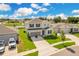 Two-story house with driveway and basketball hoop at 332 Bow Ln, Haines City, FL 33844