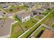 Aerial view of house, yard, and community playground at 332 Bow Ln, Haines City, FL 33844