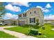 Two-story house with gray siding, dark shutters, and a basketball hoop, viewed from the side at 332 Bow Ln, Haines City, FL 33844