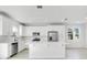 Modern kitchen with white cabinets, stainless steel appliances, and a large island at 332 Bow Ln, Haines City, FL 33844