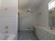 Spacious bathroom features a tub, walk-in shower, and a large vanity area at 34122 Park Ln, Leesburg, FL 34788