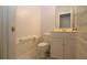 Cozy bathroom with white cabinets and toilet at 34122 Park Ln, Leesburg, FL 34788