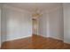 Empty dining room with hardwood floors, crown molding, and a decorative chandelier at 34122 Park Ln, Leesburg, FL 34788