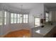 Charming kitchen nook with bay window, plantation shutters, and floral valances at 34122 Park Ln, Leesburg, FL 34788