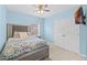 Bedroom with a queen-size bed and double doors at 34405 Alameda Dr, Sorrento, FL 32776