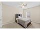 Bright bedroom with a comfortable bed and ceiling fan at 34405 Alameda Dr, Sorrento, FL 32776