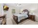 Spacious bedroom with a comfortable bed and ample natural light at 34405 Alameda Dr, Sorrento, FL 32776