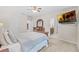 Spacious bedroom with a large bed, dresser, and TV at 34405 Alameda Dr, Sorrento, FL 32776