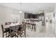 Dining area with kitchen access and view into Gathering room at 34405 Alameda Dr, Sorrento, FL 32776